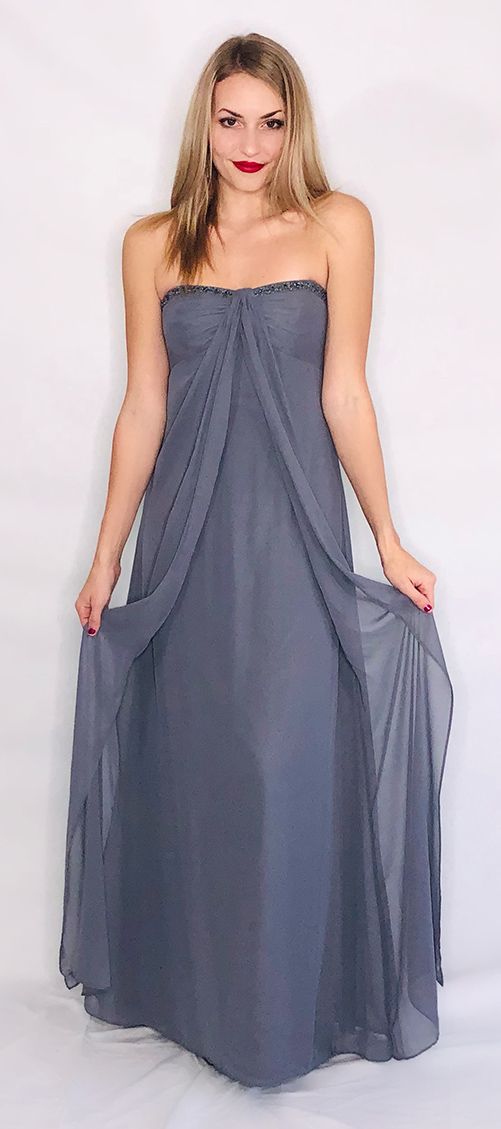 model in blue-gray strapless gown with beads at top seam and sheer overlay