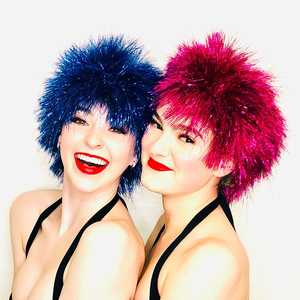 smiling models in a short metallic pixie wigs in blue and in pink