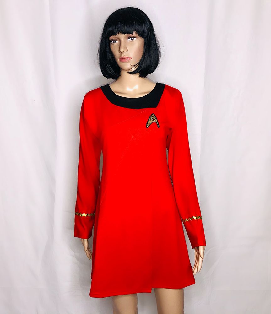 mannequin in red star trek dress with insignia, and black trim around neckline