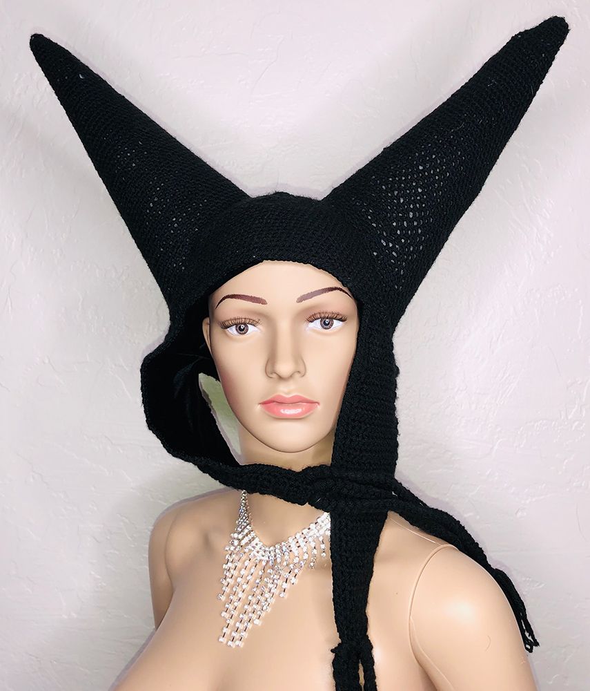 mannequin in crocheted black hat with two large horns in a vee shape