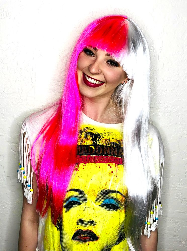 smiling model in a long hot-pink and silver wig