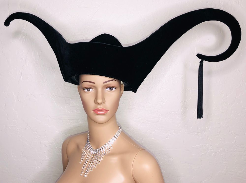 mannequin in black velvet hat with flared curlicues to each side